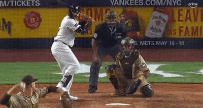 A Baseball Game Is Being Played In Front Of A Yankees Advertisement GIF
