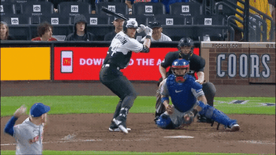 A Baseball Game Is Being Played In Front Of An Ad For Coors Beer GIF