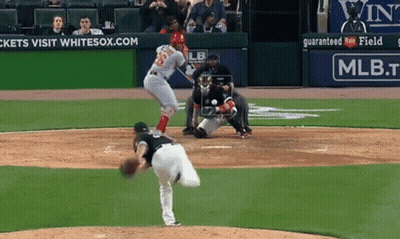 A Baseball Game Is Being Played In Front Of An Ad For Mlb GIF