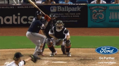 A Baseball Game Is Being Played In Front Of An Advertisement For Ballpark GIF
