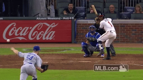 A Baseball Game Is Being Played In Front Of An Advertisement For Coca-Cola GIF