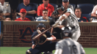 A Baseball Game Is Being Played In Front Of An Auburn Brick Wall GIF