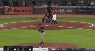 A Baseball Game Is Being Played With A Gorilla Glue Ad In The Background GIF