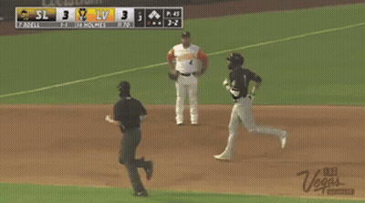 A Baseball Game Is Being Played With A Green Valley Grocery Advertisement On The Fence GIF