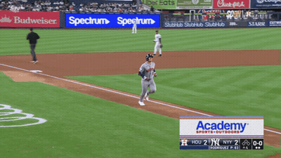 A Baseball Game Is Being Played With A Spectrum Ad In The Outfield GIF