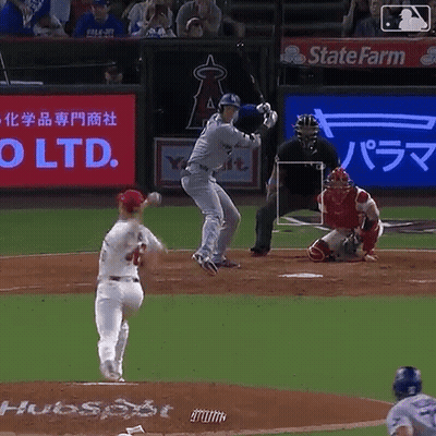 A Baseball Game Is Being Played With A State Farm Ad In The Background GIF