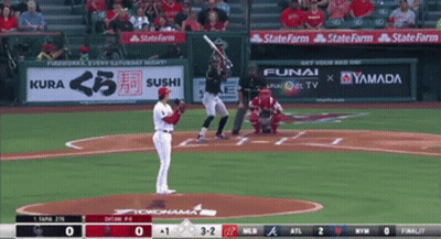 A Baseball Game Is Being Played With Advertisements For Kura Sushi Funai And Yamada On The Outfield Wall GIF