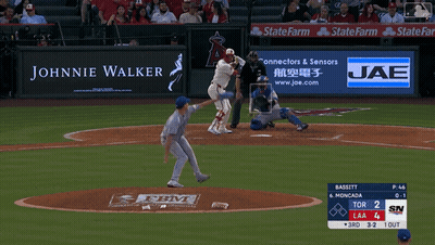 A Baseball Game Is Being Played With An Ad For Johnnie Walker GIF