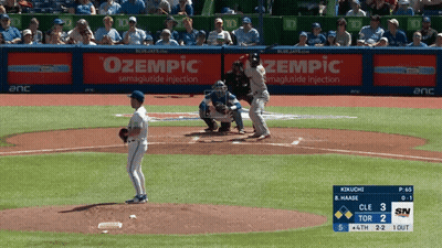 A Baseball Game Is Being Played With An Ad For Zempic GIF