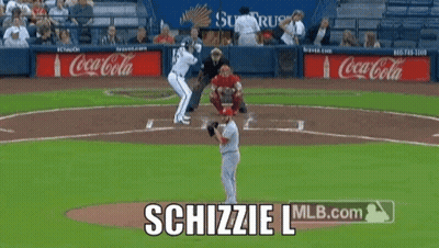 A Baseball Game Is Being Played With Coca-Cola Advertisements In The Outfield GIF