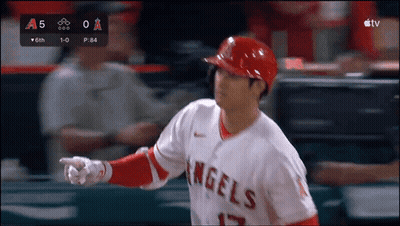 A Baseball Player For The Angels Is Pointing At Something In The Distance GIF