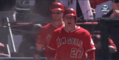 A Baseball Player For The Angels Is Standing In Front Of A Sign That Says Old Service GIF