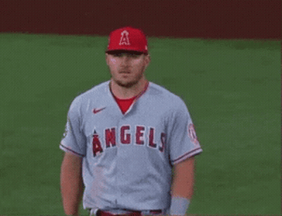A Baseball Player For The Angels Is Standing On A Field . GIF