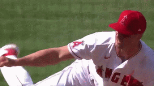 A Baseball Player For The Angels Is Throwing A Baseball GIF