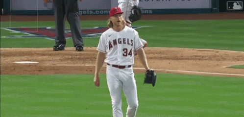 A Baseball Player For The Angels Stands On The Field GIF