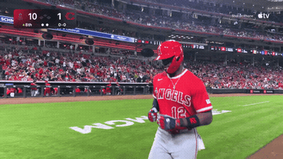 a baseball player for the angels stands on the field during a game