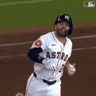 A Baseball Player For The Astros Is Running Towards The Base GIF
