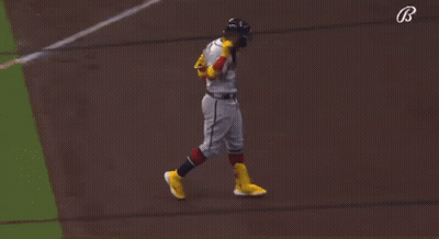 A Baseball Player For The Atlanta Braves Is Pointing Up GIF