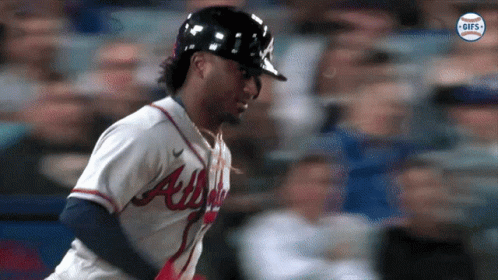 A Baseball Player For The Atlanta Braves Is Running GIF