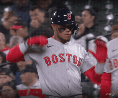 A Baseball Player For The Boston Red Sox Is Wearing A Helmet And Sunglasses GIF