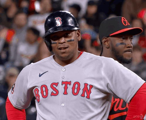 A Baseball Player For The Boston Red Sox Stands In Front Of Another Player GIF