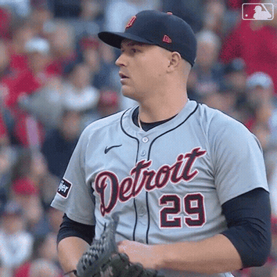 A Baseball Player For The Detroit Tigers Holds His Glove GIF