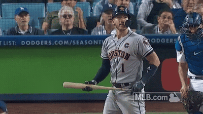 A Baseball Player For The Houston Astros Holds A Bat GIF