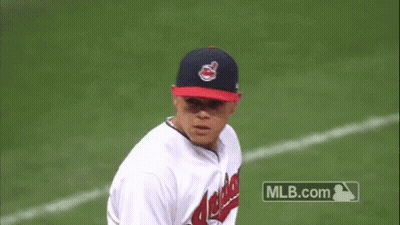 A Baseball Player For The Indians Is Throwing A Baseball GIF