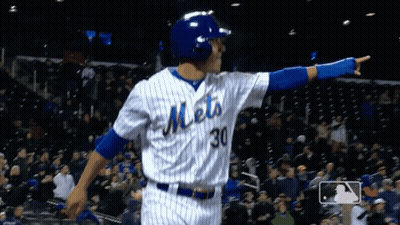 A Baseball Player For The Mets Is Pointing To The Crowd GIF