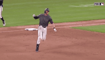 A Baseball Player For The Ny Yankees Is Running On A Field GIF