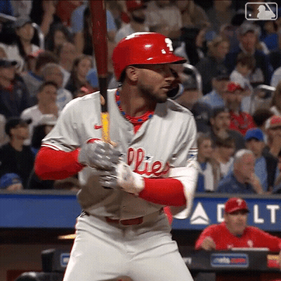 A Baseball Player For The Phillies Is Getting Ready To Swing His Bat GIF