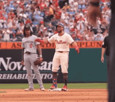 A Baseball Player For The Phillies Is Standing On Base GIF