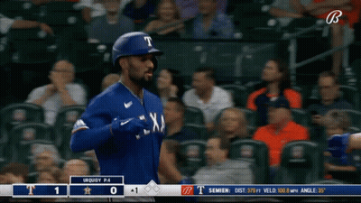 A Baseball Player For The Texas Rangers Is Walking Towards The Base GIF