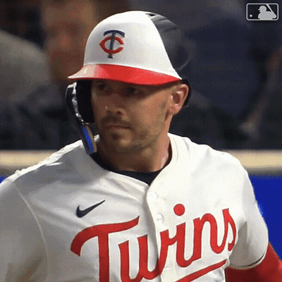 A Baseball Player For The Twins Is Wearing A Helmet And Jersey GIF