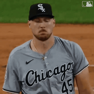 A Baseball Player From The Chicago White Sox Is Standing On The Field With His Eyes Closed GIF