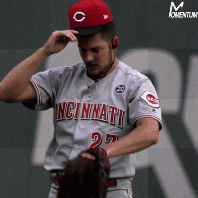 A Baseball Player From The Cincinnati Reds Adjusts His Cap GIF