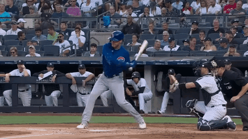 A Baseball Player Getting Ready To Hit A Ball With A Chicago Cubs Jersey On GIF