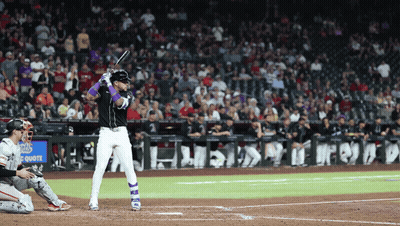 A Baseball Player Getting Ready To Hit The Ball In Front Of A Sign That Says Chase GIF