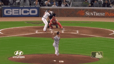 A Baseball Player Getting Ready To Hit The Ball With A Hyundai Logo Behind Him GIF