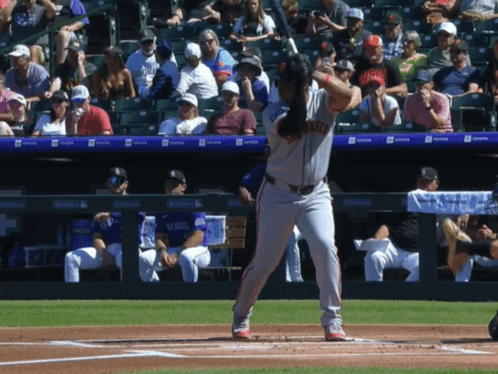 A Baseball Player Getting Ready To Hit The Ball With The Word Giants On His Shirt GIF