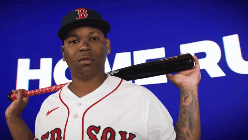 A Baseball Player Holding A Bat In Front Of A Blue Background With The Word Homer On It GIF