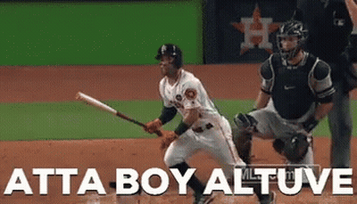 A Baseball Player Holding A Bat With The Words Atta Boy Altuve Written On The Bottom GIF