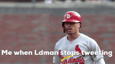 A Baseball Player In A Cardinals Uniform Is Celebrating GIF