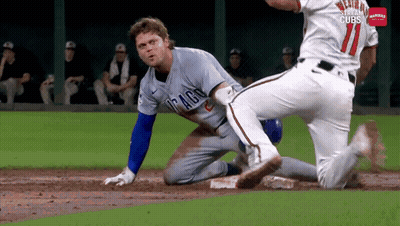 A Baseball Player In A Chicago Cubs Uniform Is Sliding Into Base GIF