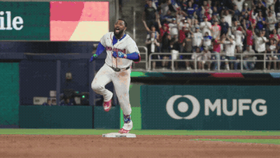 A Baseball Player In A Dominican Jersey Is Running Towards Home Plate GIF