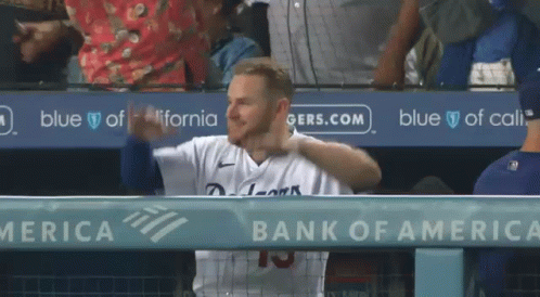 A Baseball Player In A Dugout With A Bank Of America Ad Behind Him GIF