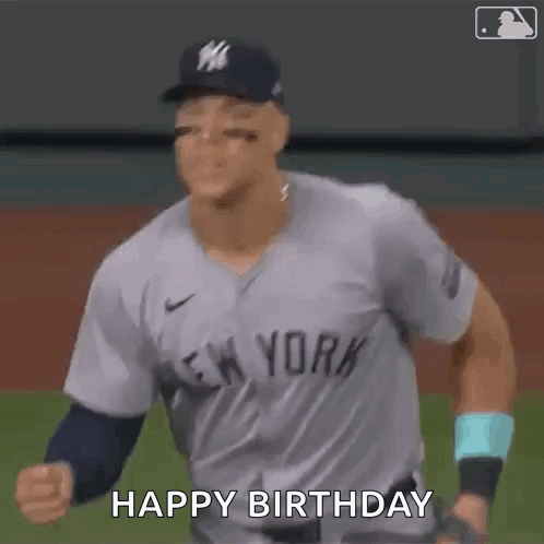 A Baseball Player In A New York Yankees Uniform Is Celebrating His Birthday On The Field . GIF