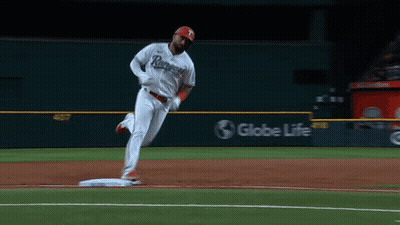 A Baseball Player In A Rangers Jersey Is Running To Base GIF