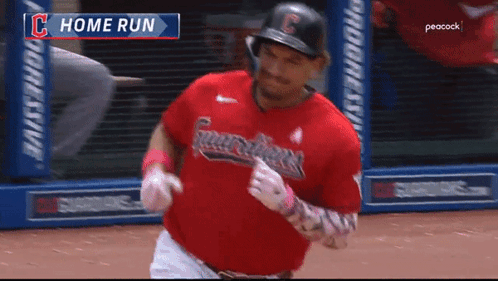 A Baseball Player In A Red Guardians Uniform Is Running On The Field GIF