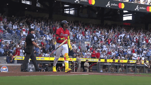 A Baseball Player In A Red Uniform With The Word Braves On The Back GIF